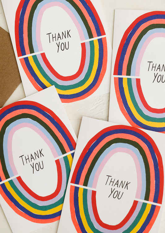 A set of rainbow colored thank you cards.