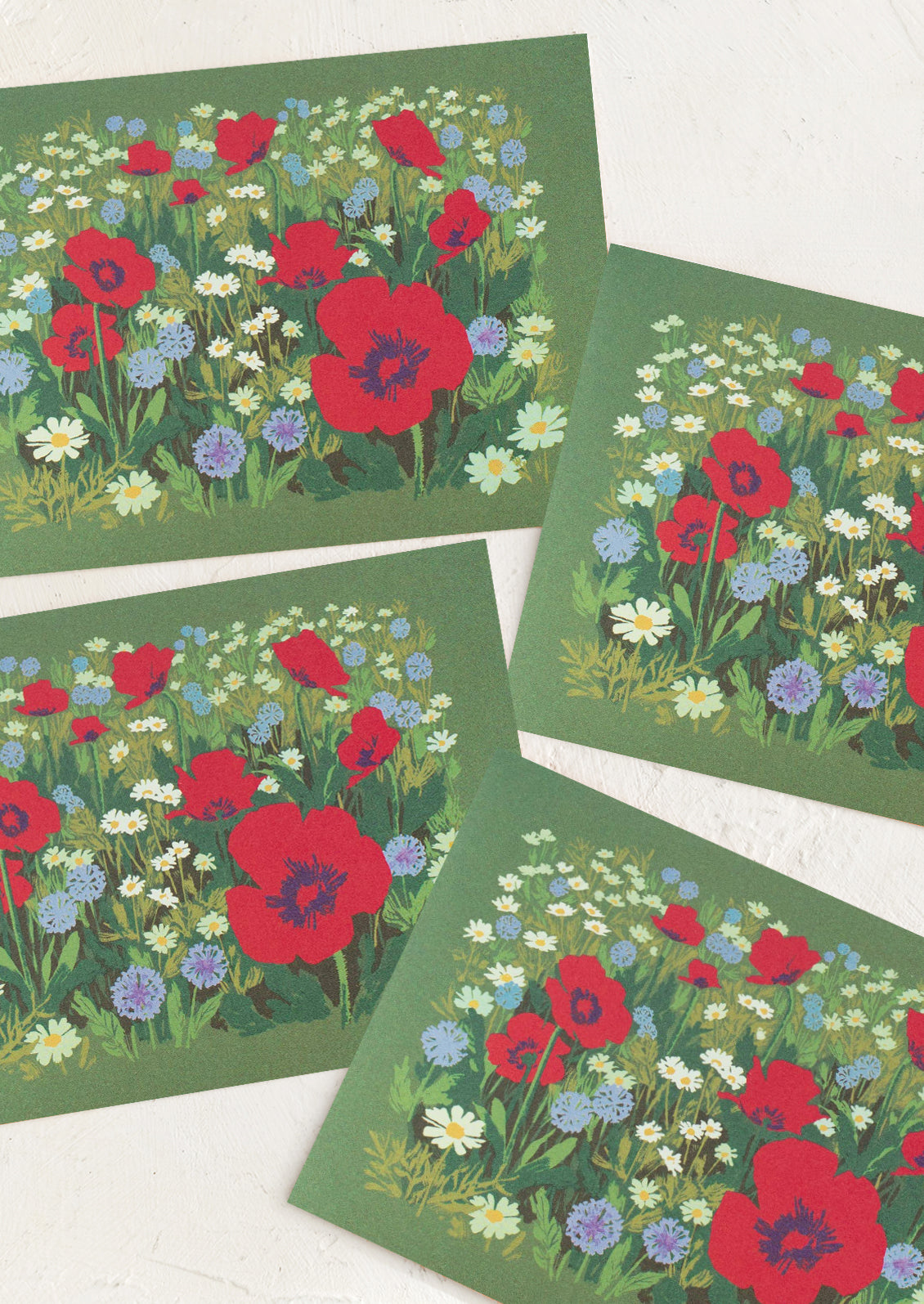 Set of four green cards with red poppies and blue and purple flowers on a white background