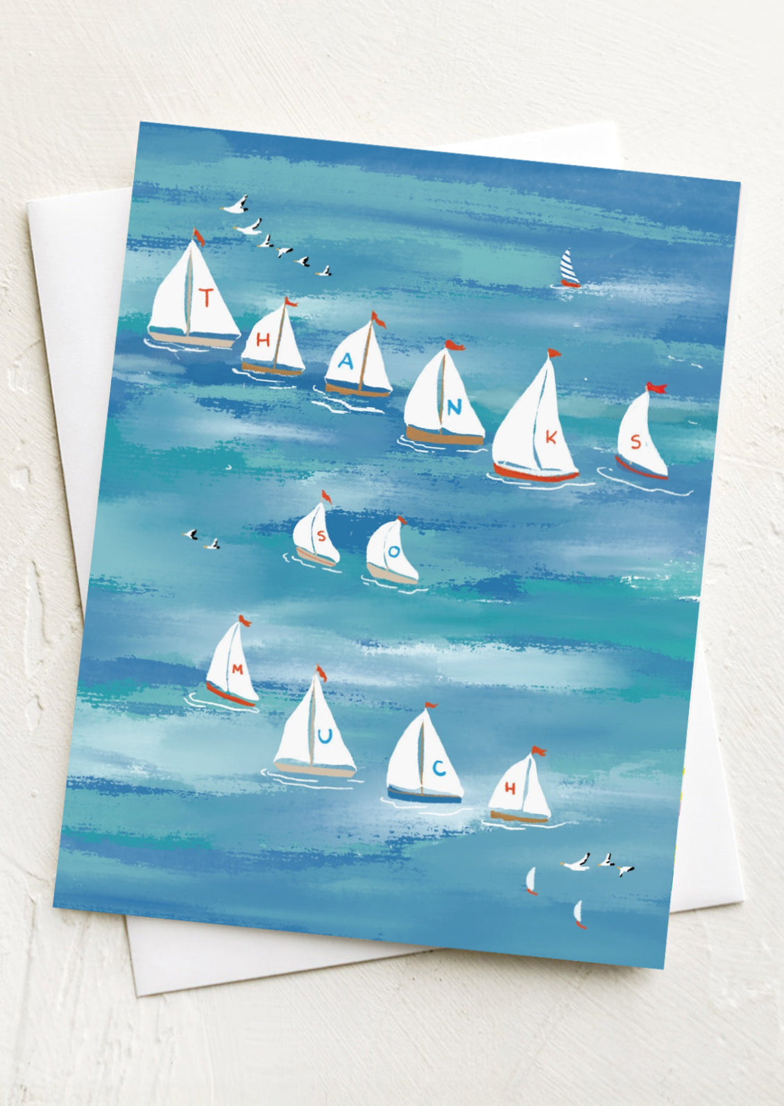 A greeting card with illustrations of sailboats, flags read "Thanks So Much".