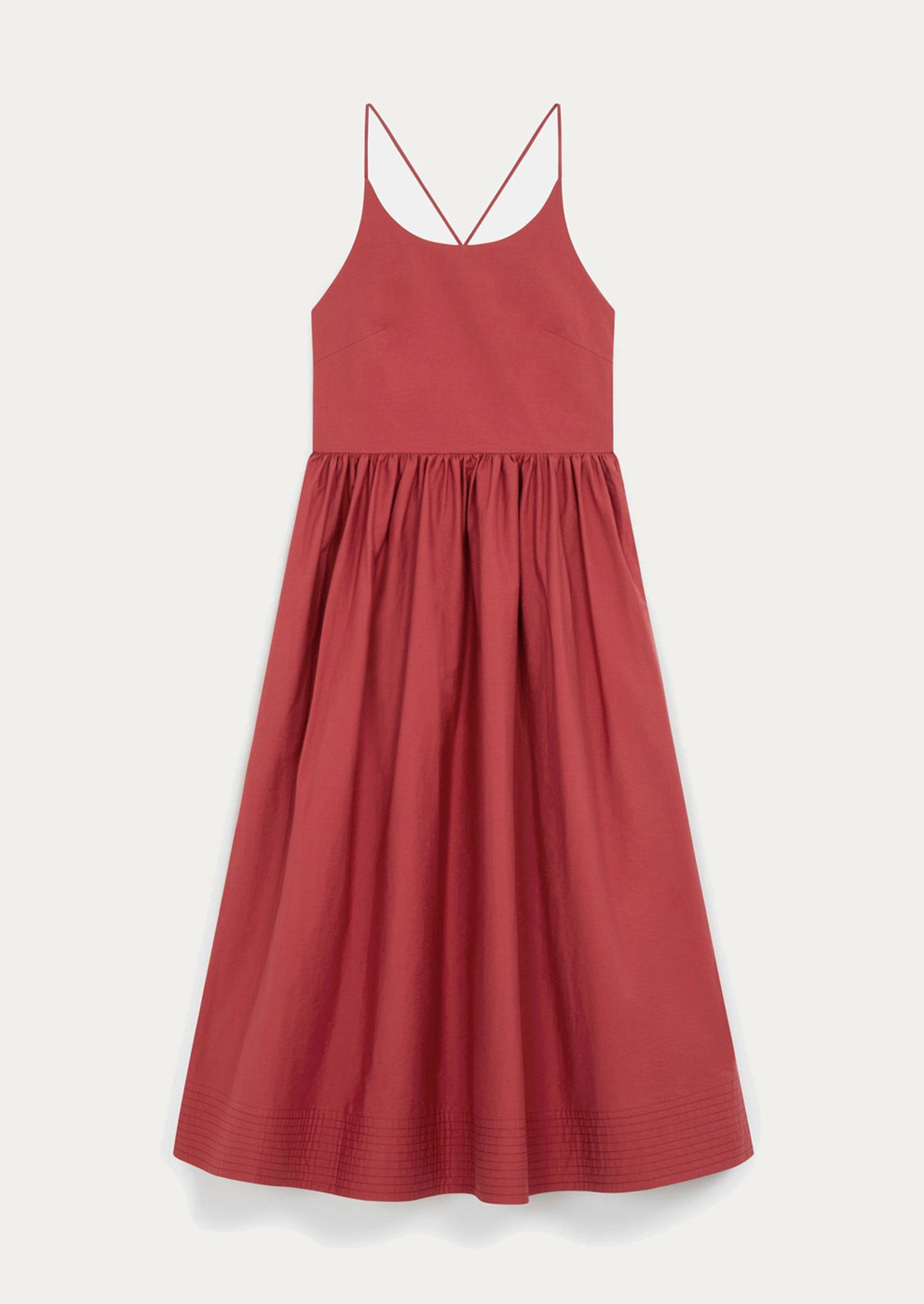 A person wearing a cross back dress.