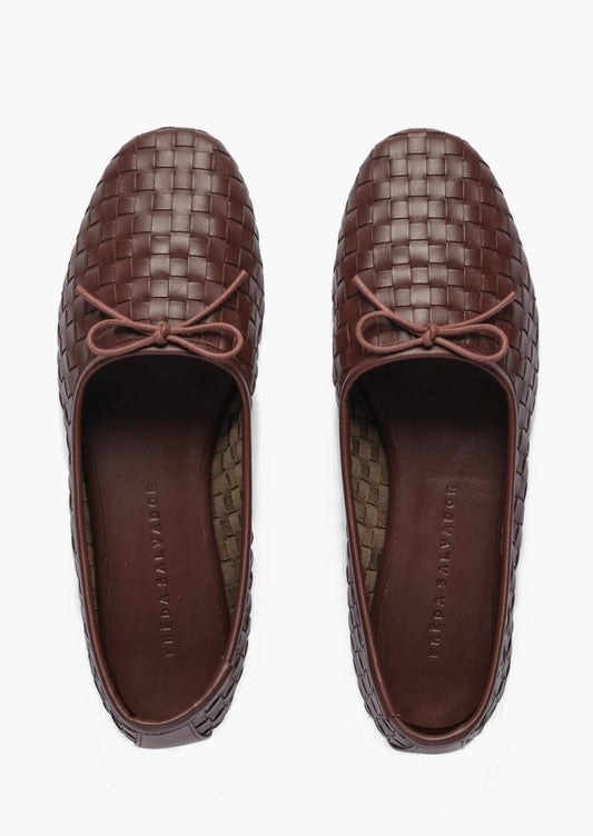 Dark brown woven leather ballet flats with bow detail.