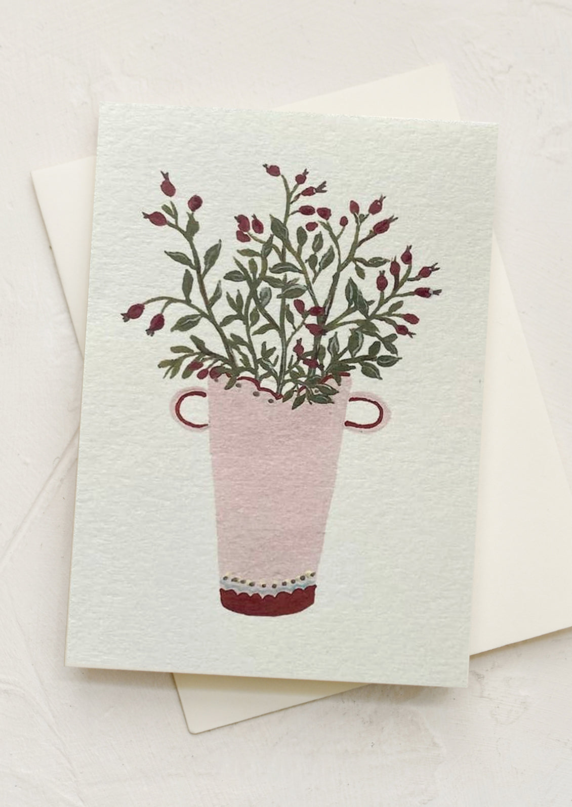 A mini greeting card in mint with illustration of rosehips in pot.