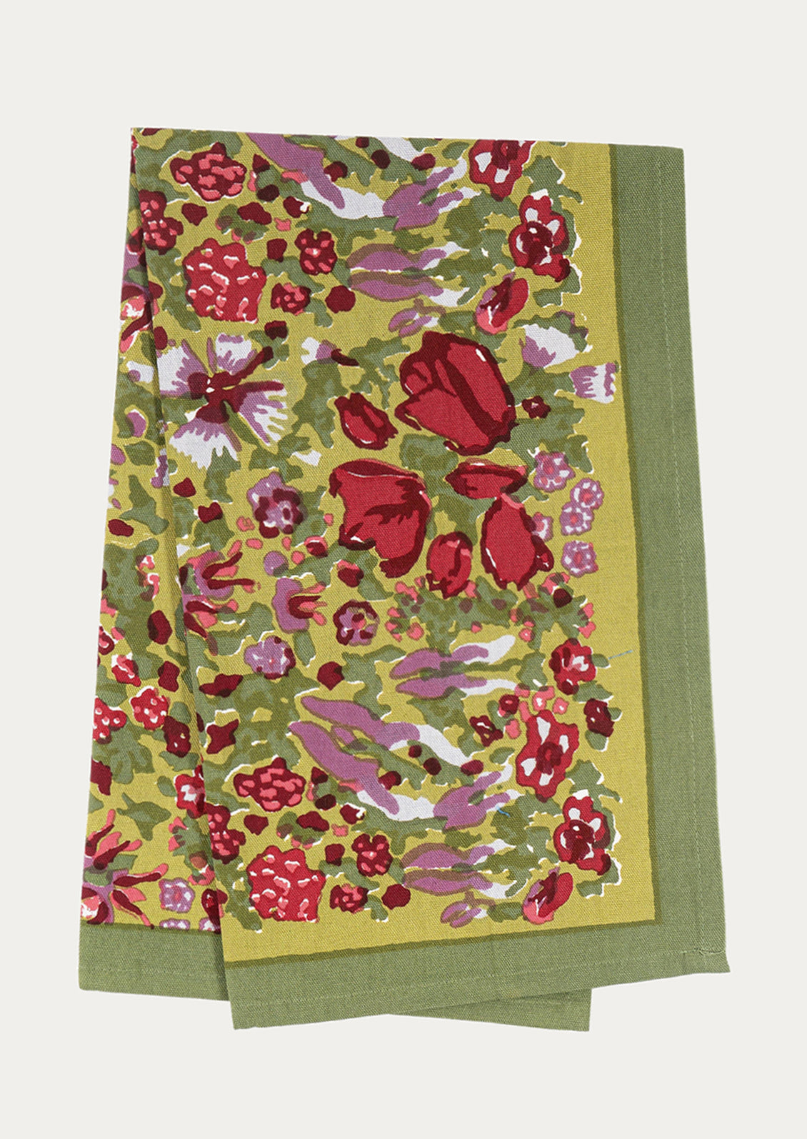 Floral patterned fabric with red, pink, and green colors on a white background