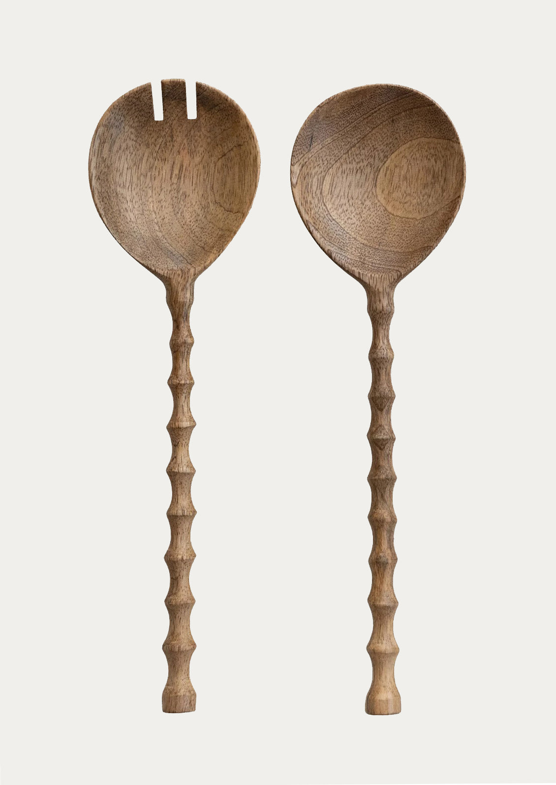 Two wooden spoons with long handles on a light gray background