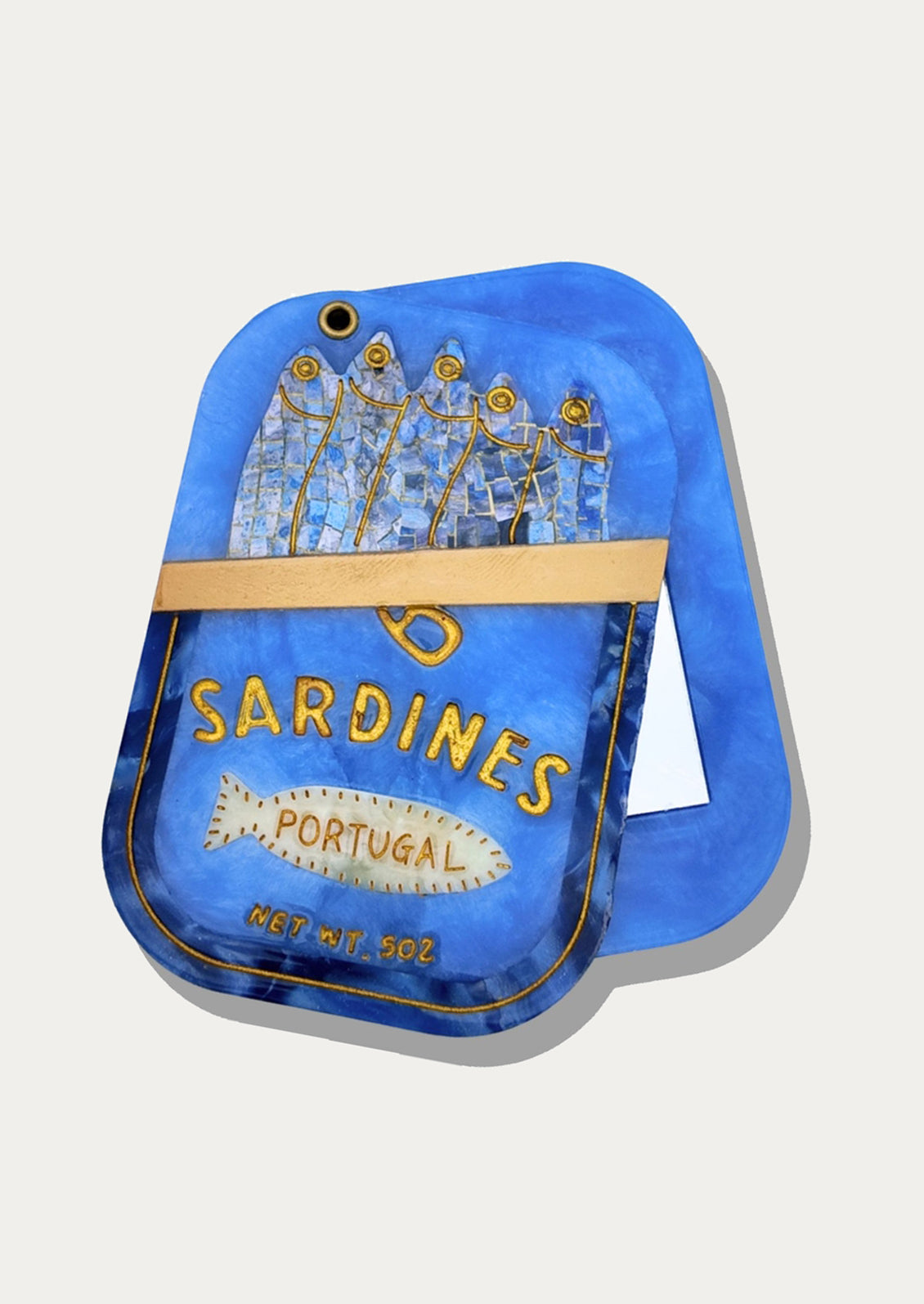Sardine tin shaped compact mirror.
