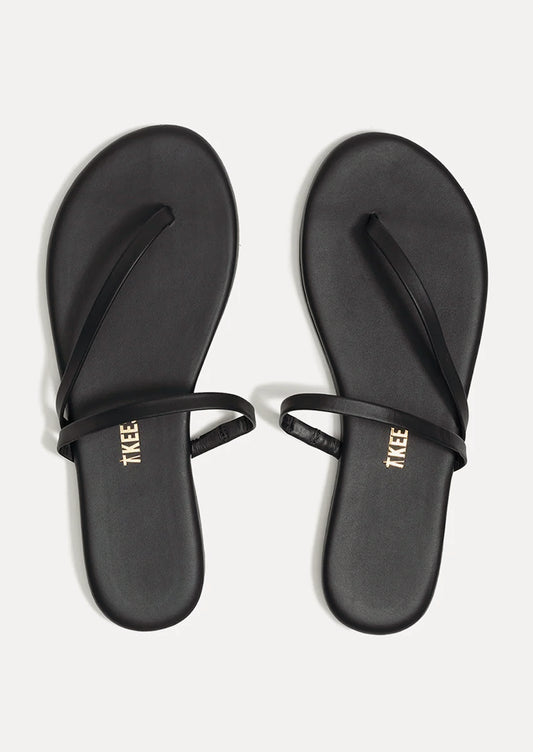 A pair of black leather strappy sandals by TKEES.