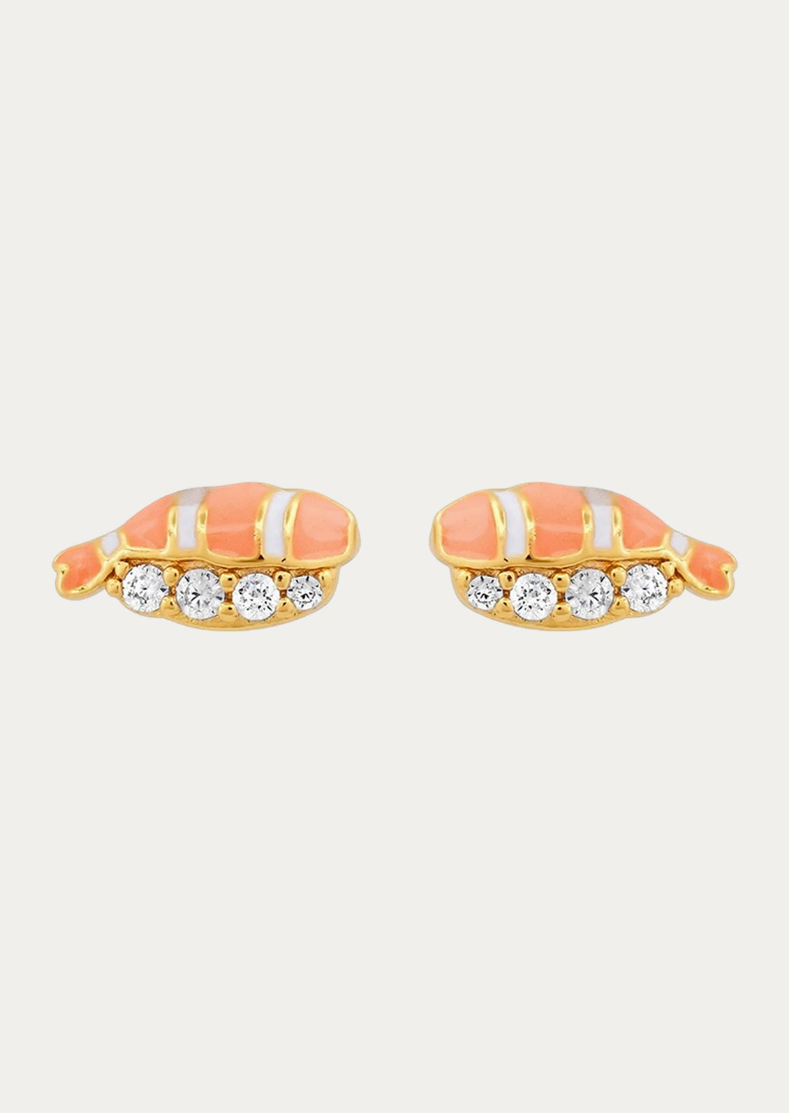 A pair of stud earrings with sashimi on them and cubic zirconia gems.