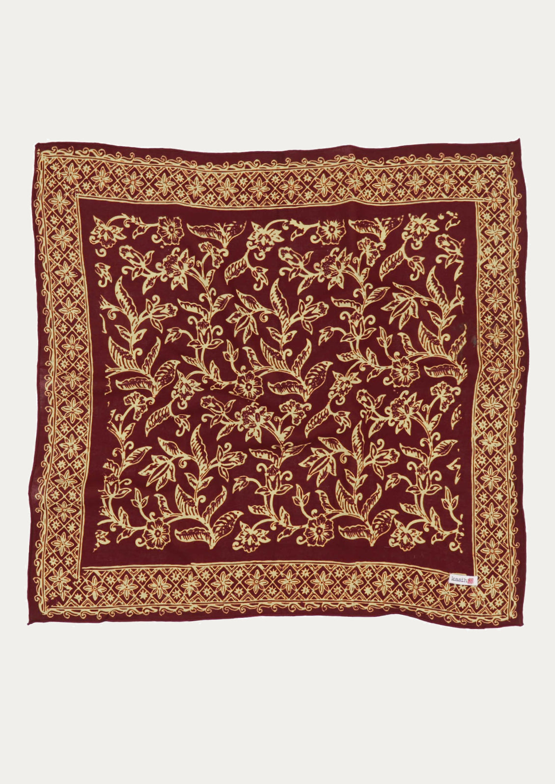 A square cotton scarf in burgundy and ivory floral pattern.
