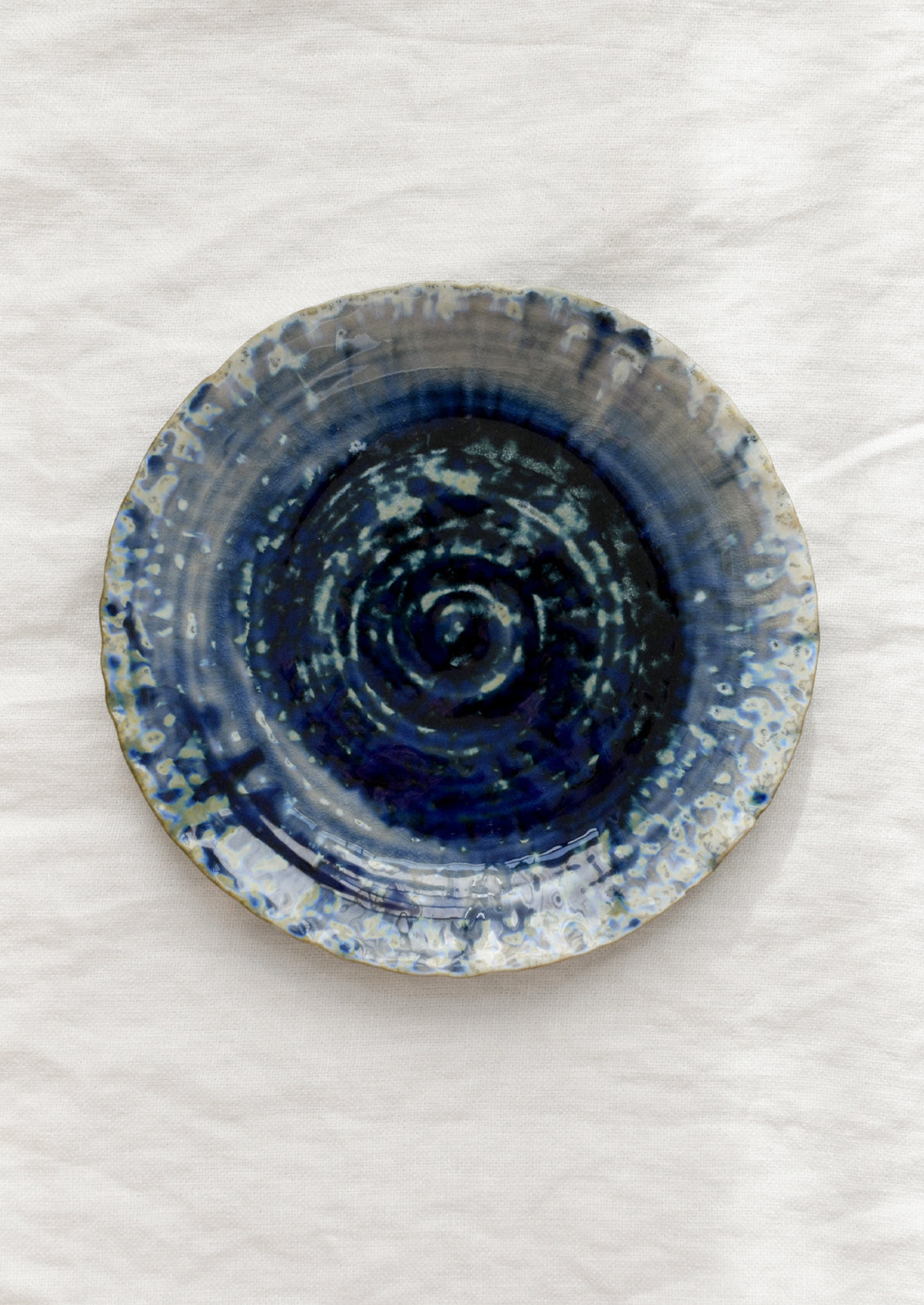 Ceramic plate with blue design on a white background