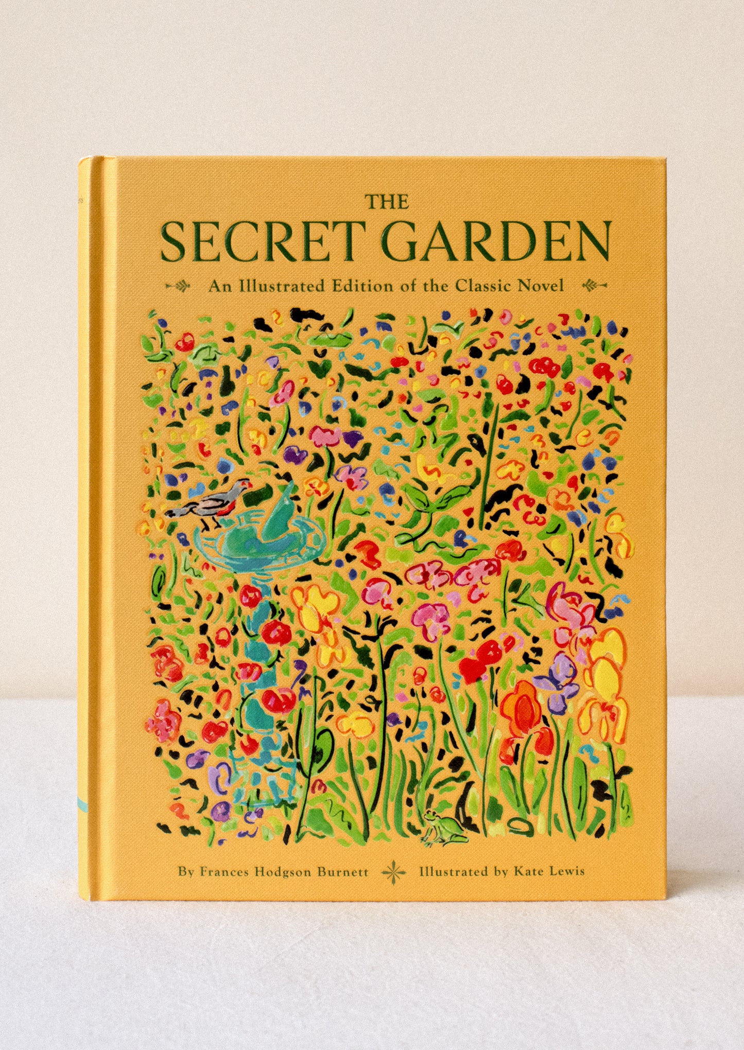 A hardcover book with yellow cover titled "The Secret Garden: An Illustrated Edition Of The Classic Novel".