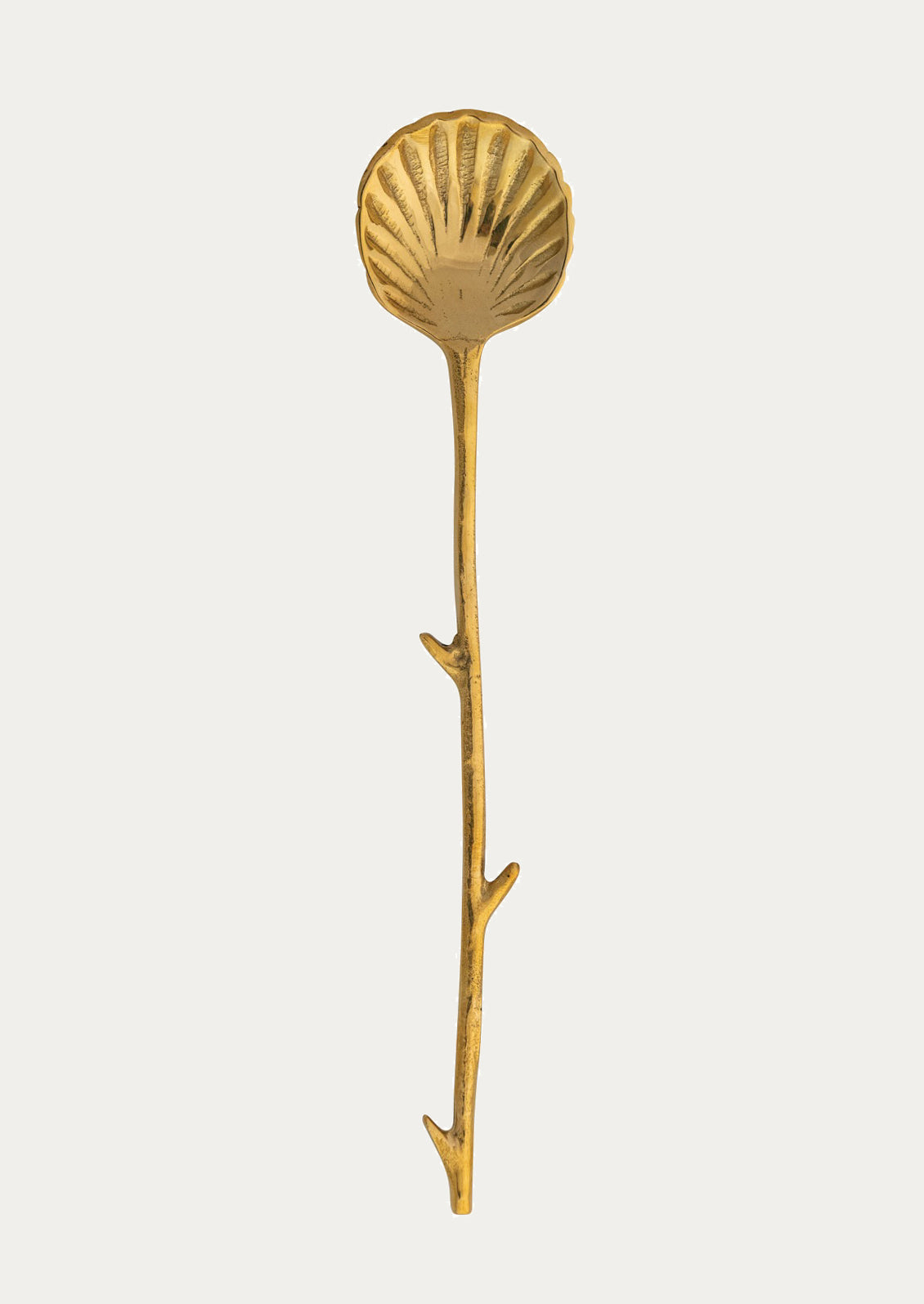 Gold shell-shaped spoon with twig-shaped handle