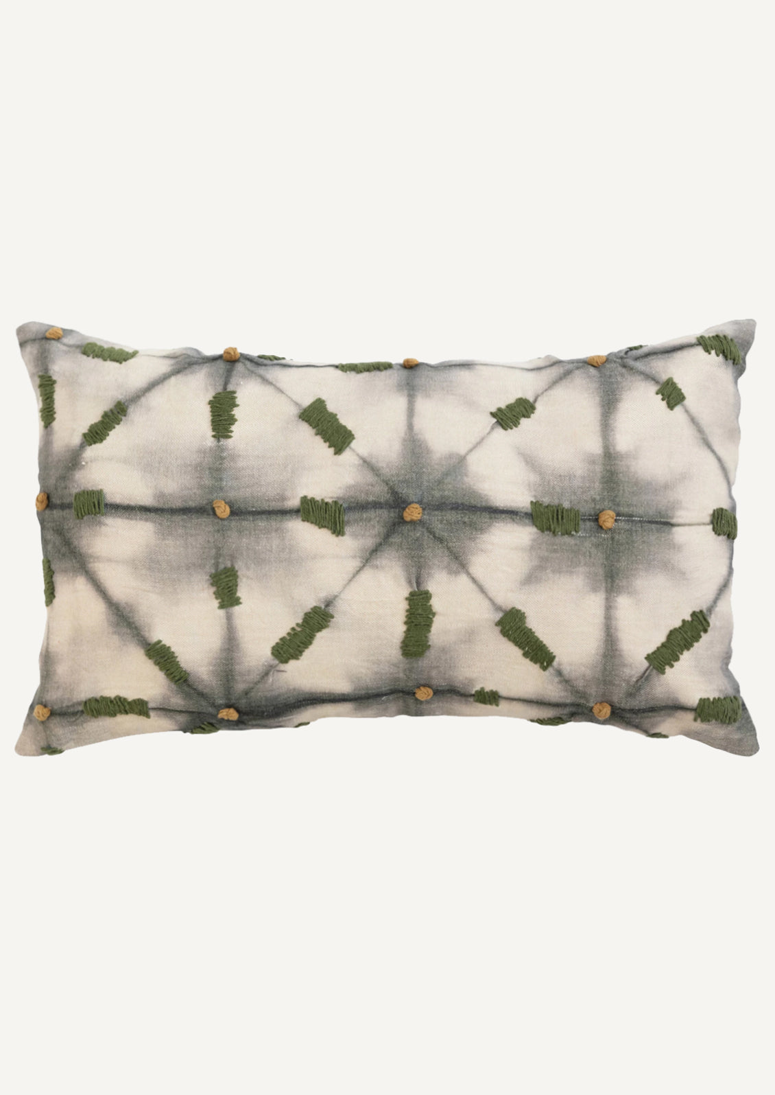 A lumar pillow in grey batik tie dye pattern with olive green embroidery detailing.