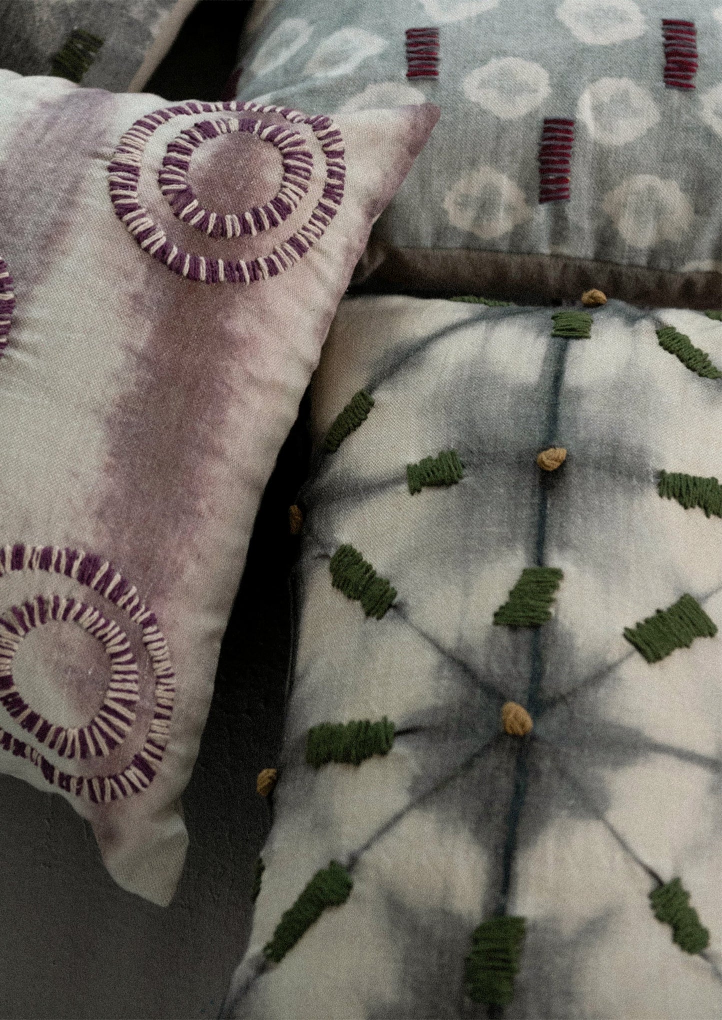 Assorted batik tie dye pillows.