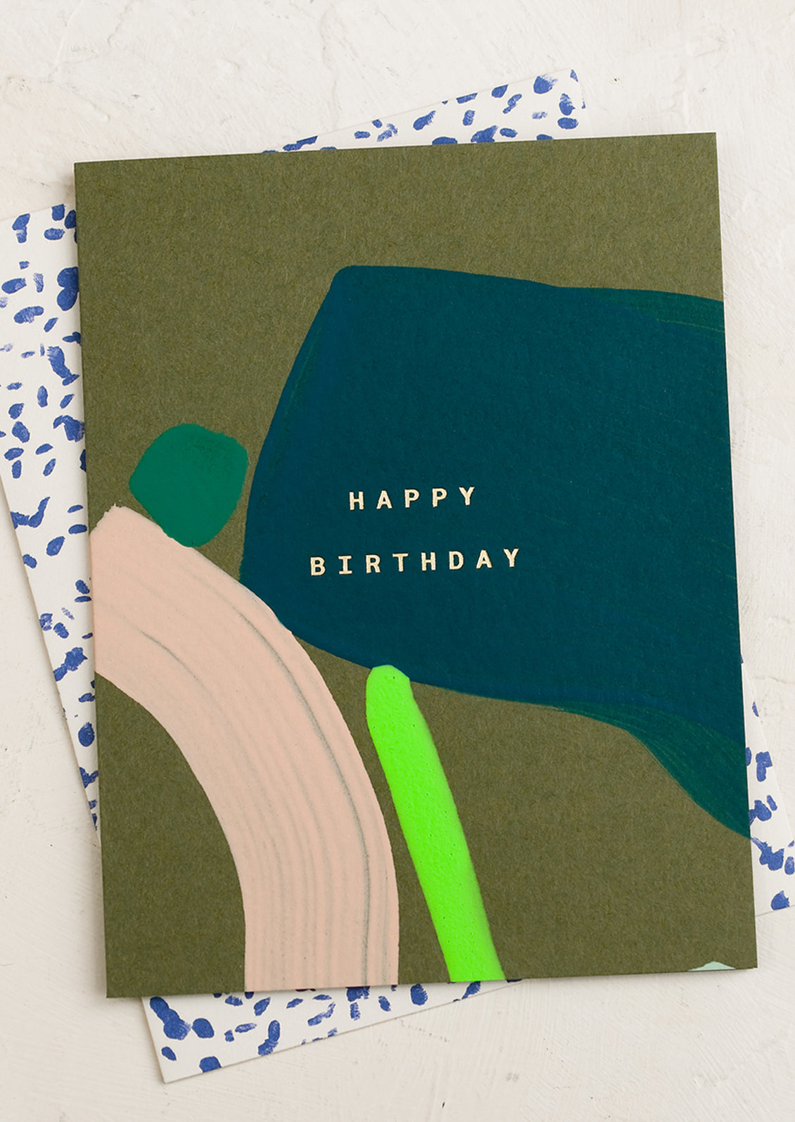 An abstract painted birthday card in tones of green and blue.