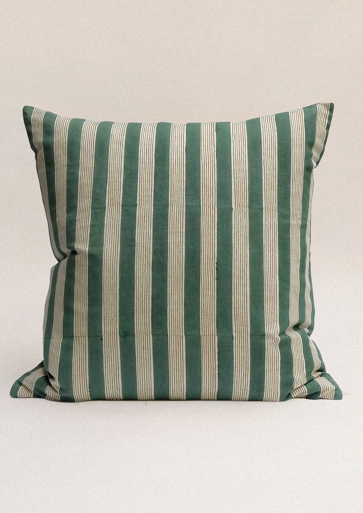 A striped throw pillow in green.