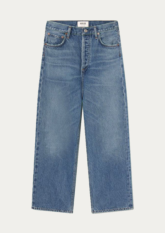 A pair of wide leg jeans in classic blue medium denim wash.