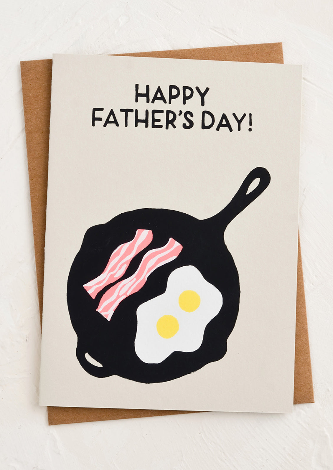 A greeting card with image of eggs and bacon in a pan.