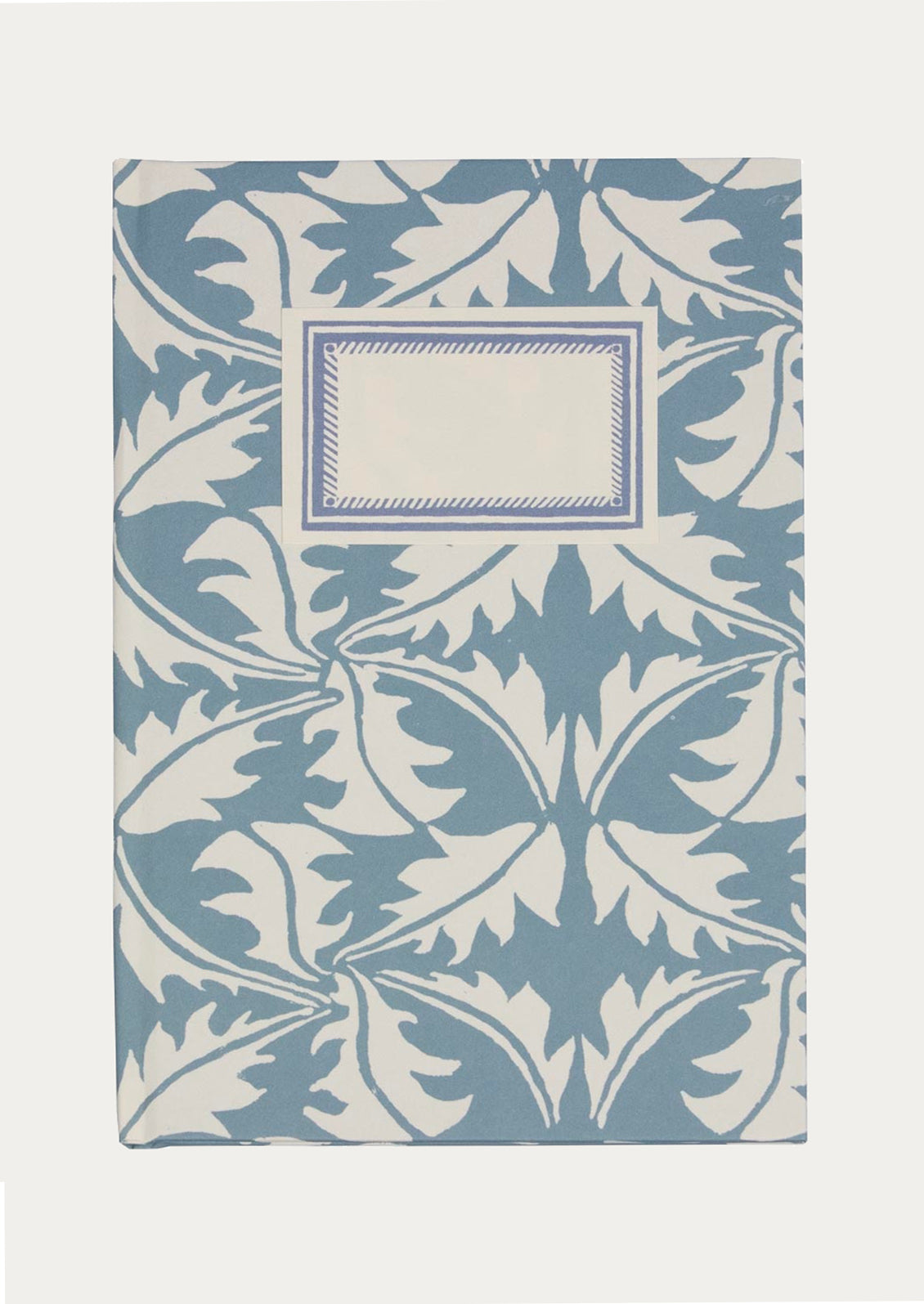 Notebook with blue floral pattern on a white background