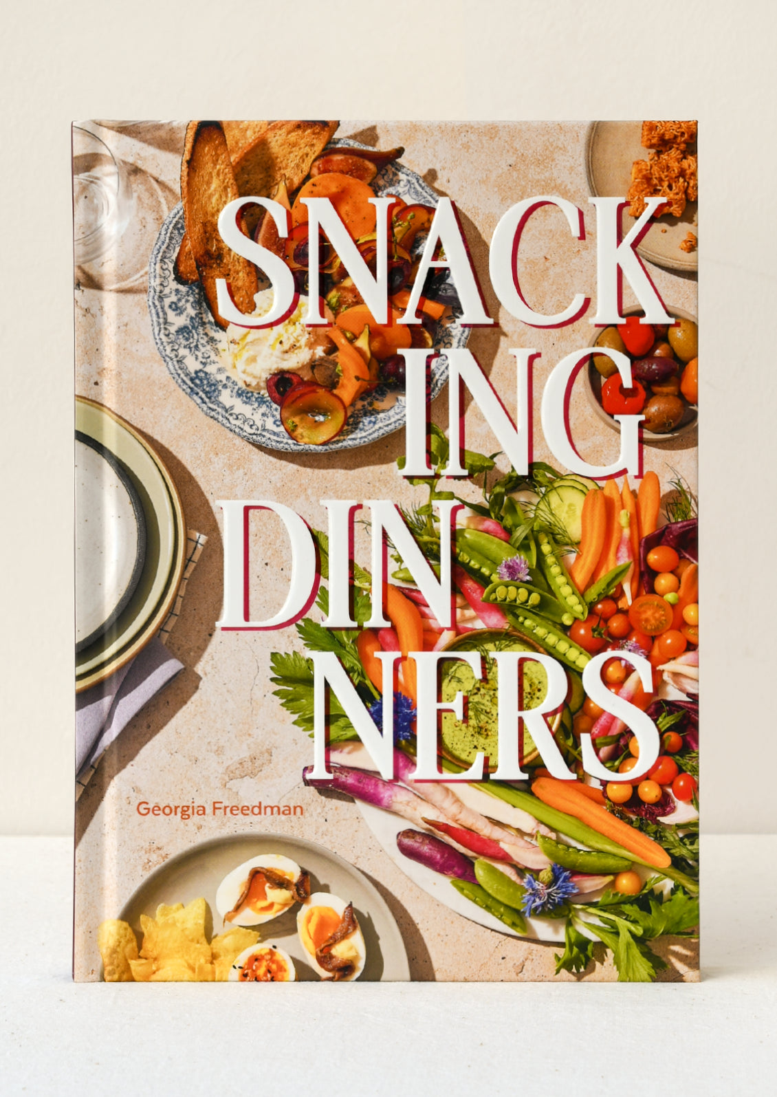 A book entitled 'Snacking DInners' by Georgia Freedman.