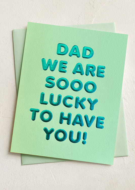 A card reading "Dad we are sooo lucky to have you!".