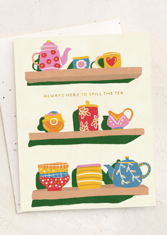 Card with illustrations of teapots and cups on shelves with text 'Always here to spill the tea'.