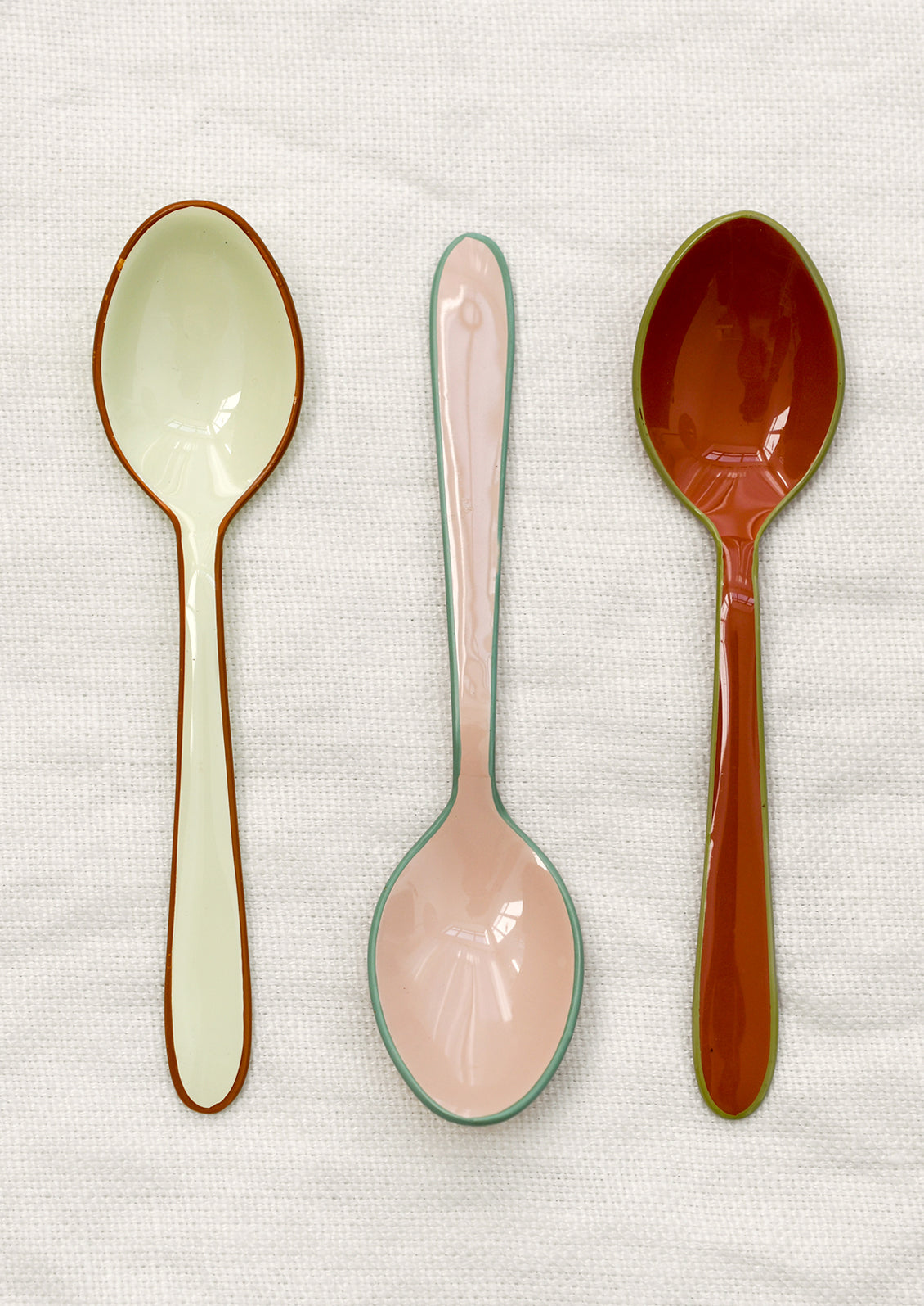Enamel spoons in warm colors.