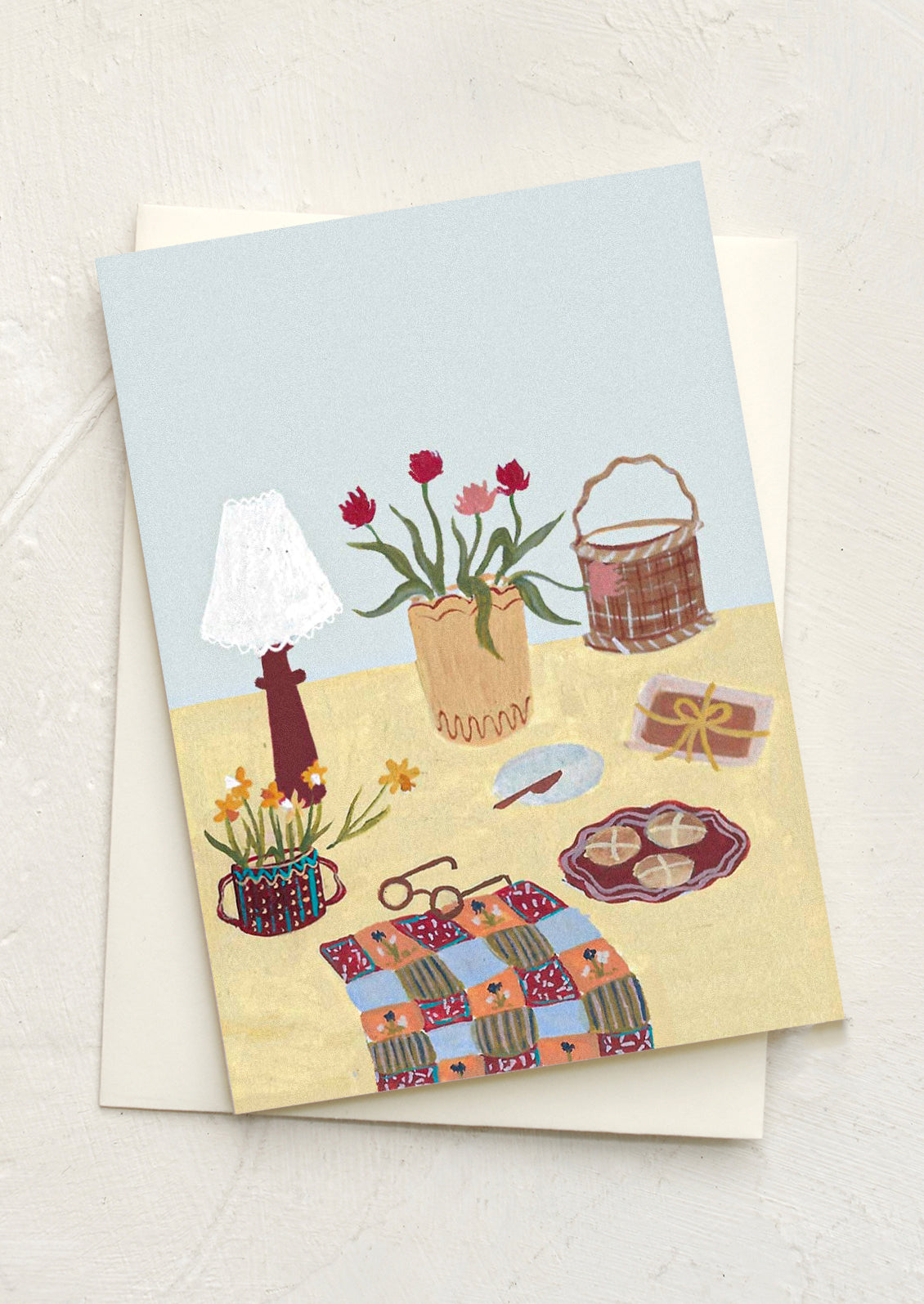An illustrated mini greeting card with still life scene of things on a table.