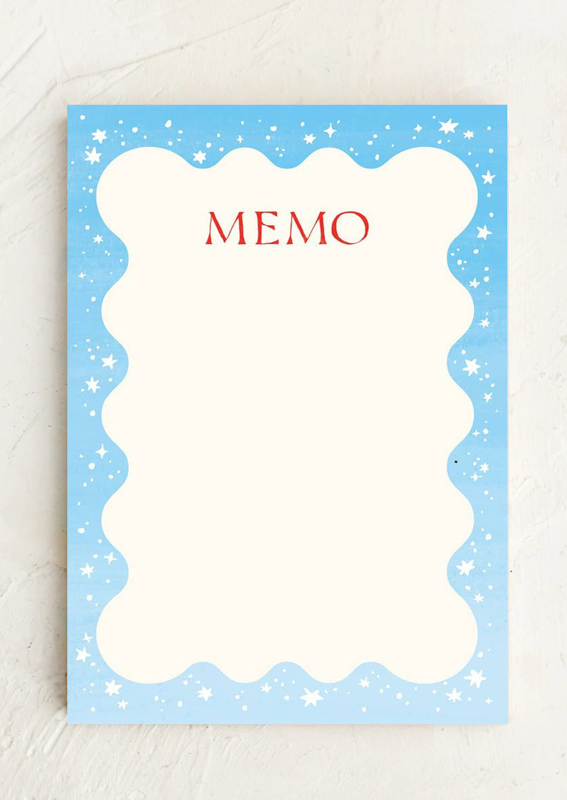 A star patterned notepad with squiggle shape writing area.
