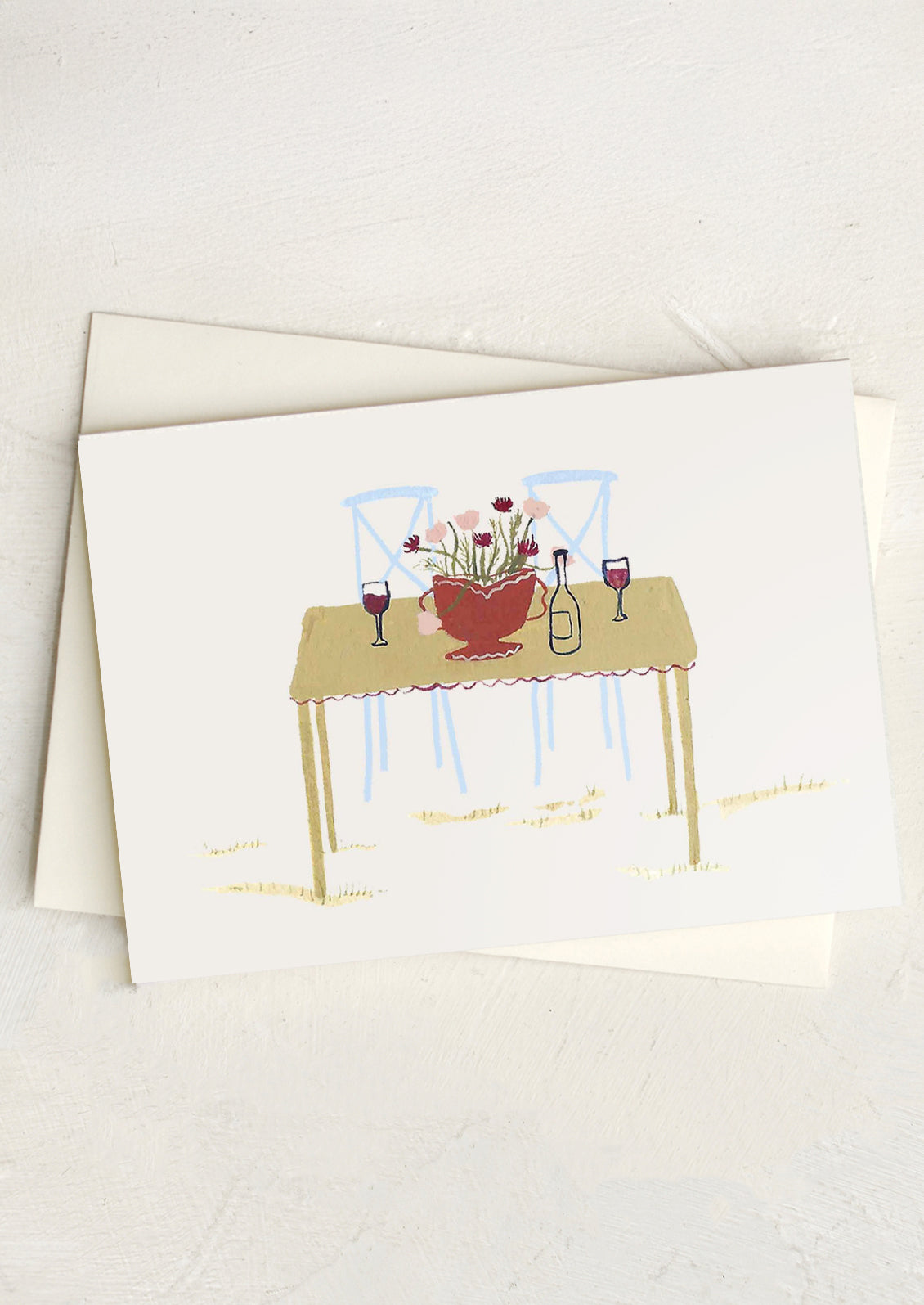 Greeting card with a table and flowers illustration on a white background