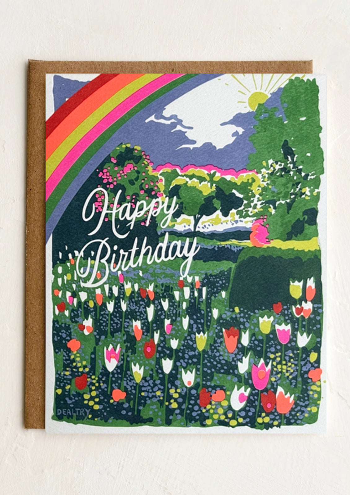 Birthday card with colorful garden scene and rainbow
