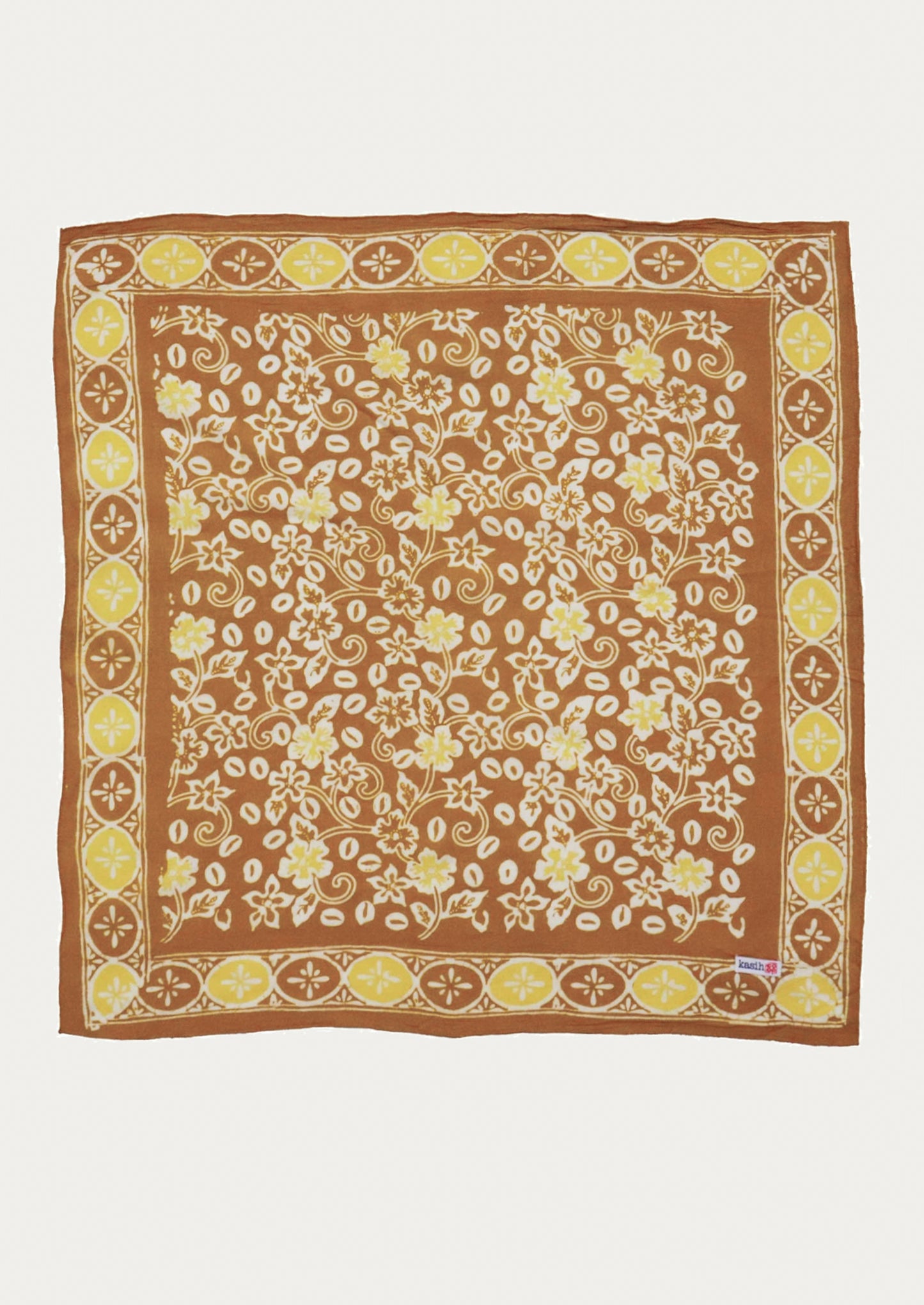 A square cotton scarf in brown and yellow floral pattern.