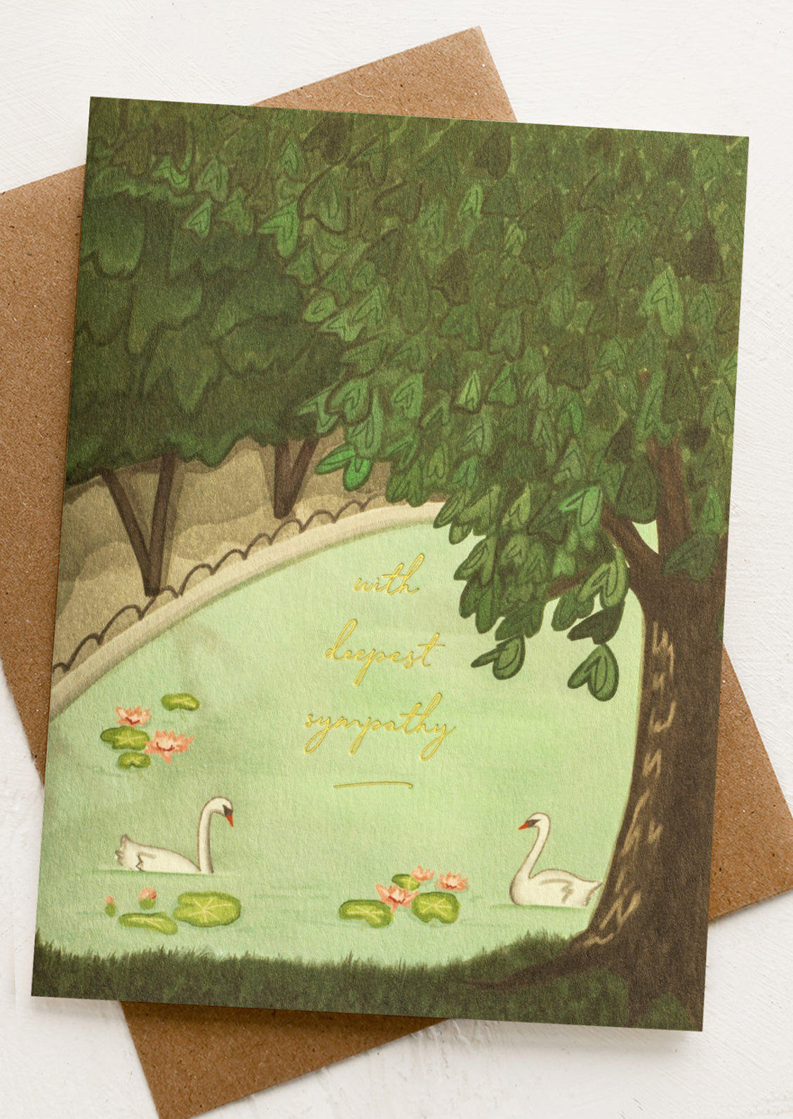 Sympathy card with swans and trees on a brown envelope