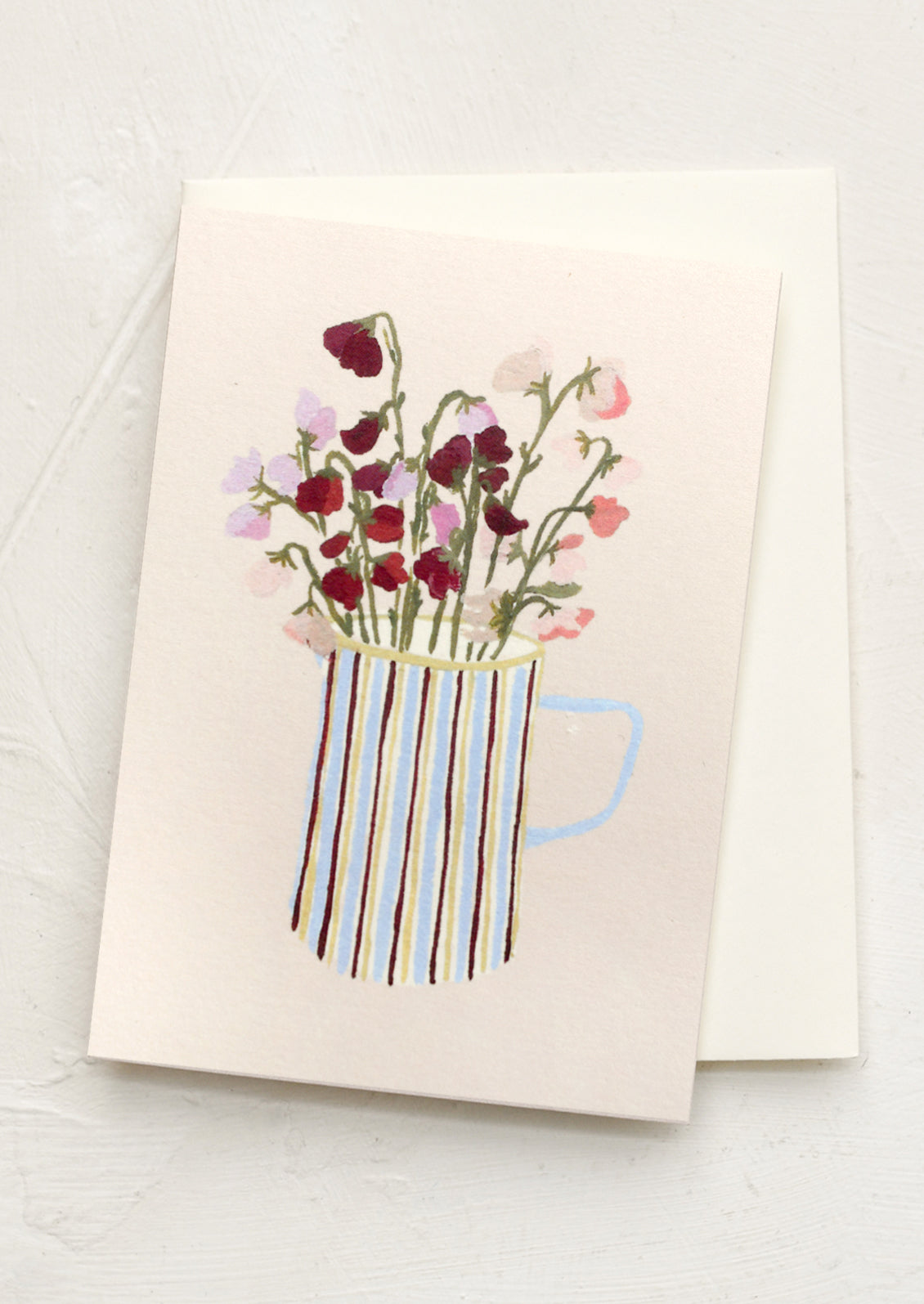A mini greeting card in cream with illustration of sweet pea flowers in striped pitcher.