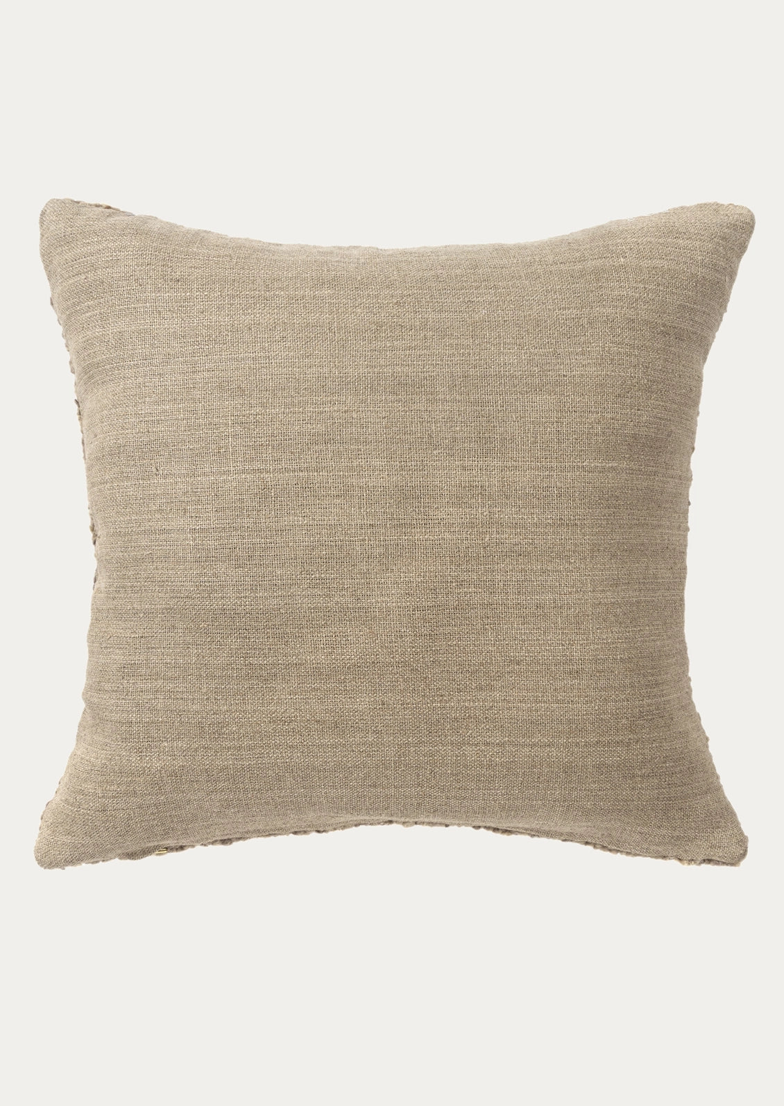 The back of a pillow in a taupe cotton canvas fabric.