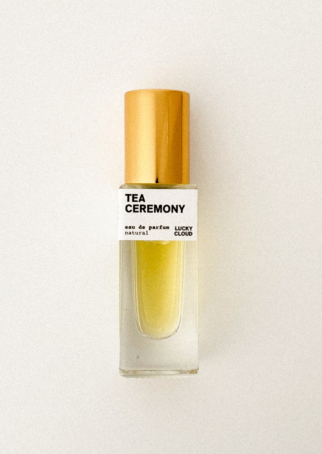 Tea Ceremony perfume bottle with gold cap on a white background