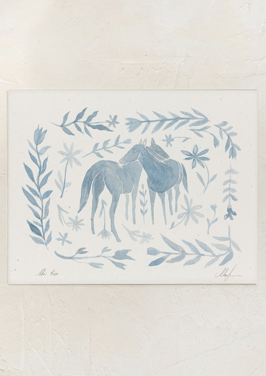 An art print of watercolor painting of two horses surrounded by floral frame in light blue.
