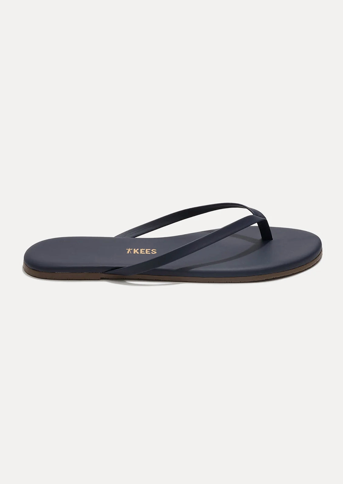 A leather skinny strap TKEES sandal in dark navy.