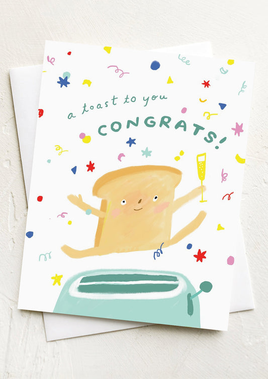 A card with illustration of an anthropomorphic piece of toast, text reads "A Toast to you, Congrats!".