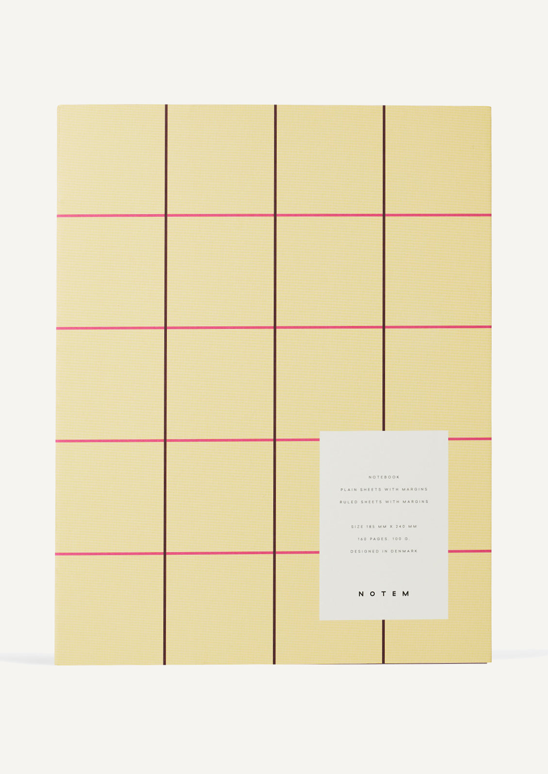 A notebook with pale yellow cover with pink grid check pattern.