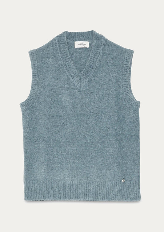 A v-neck sleeveless sweater vest in dusty blue color.