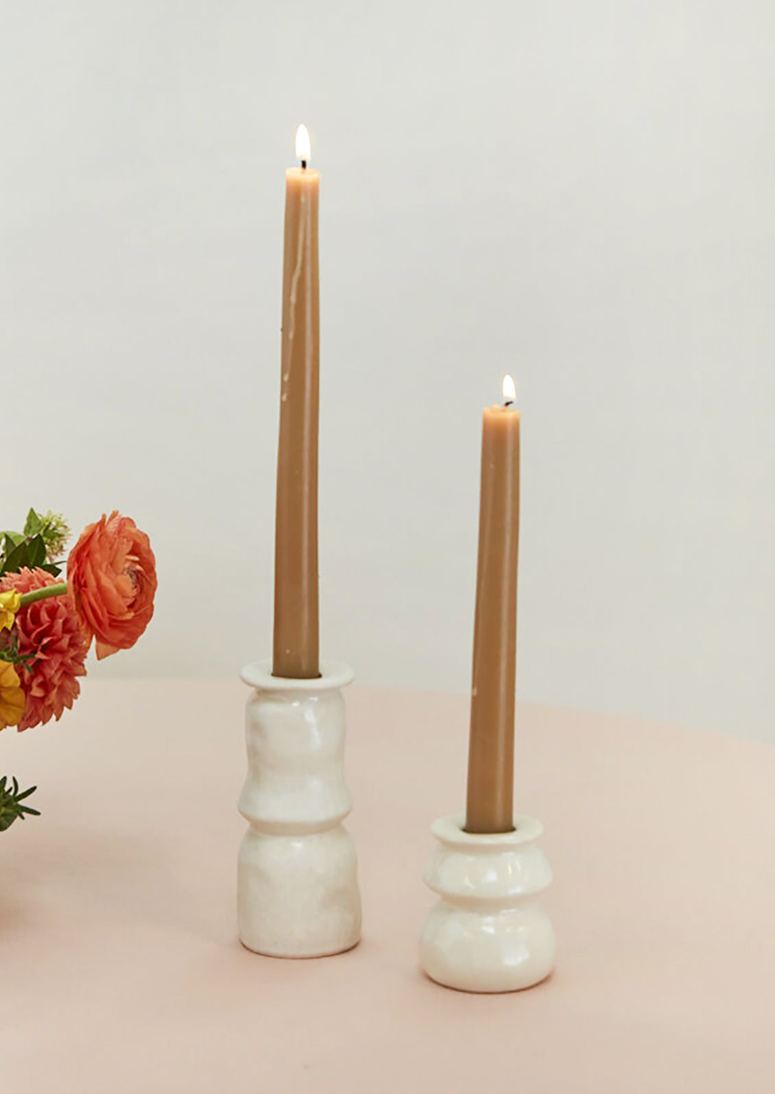 Satin finish ceramic candleholders in white.