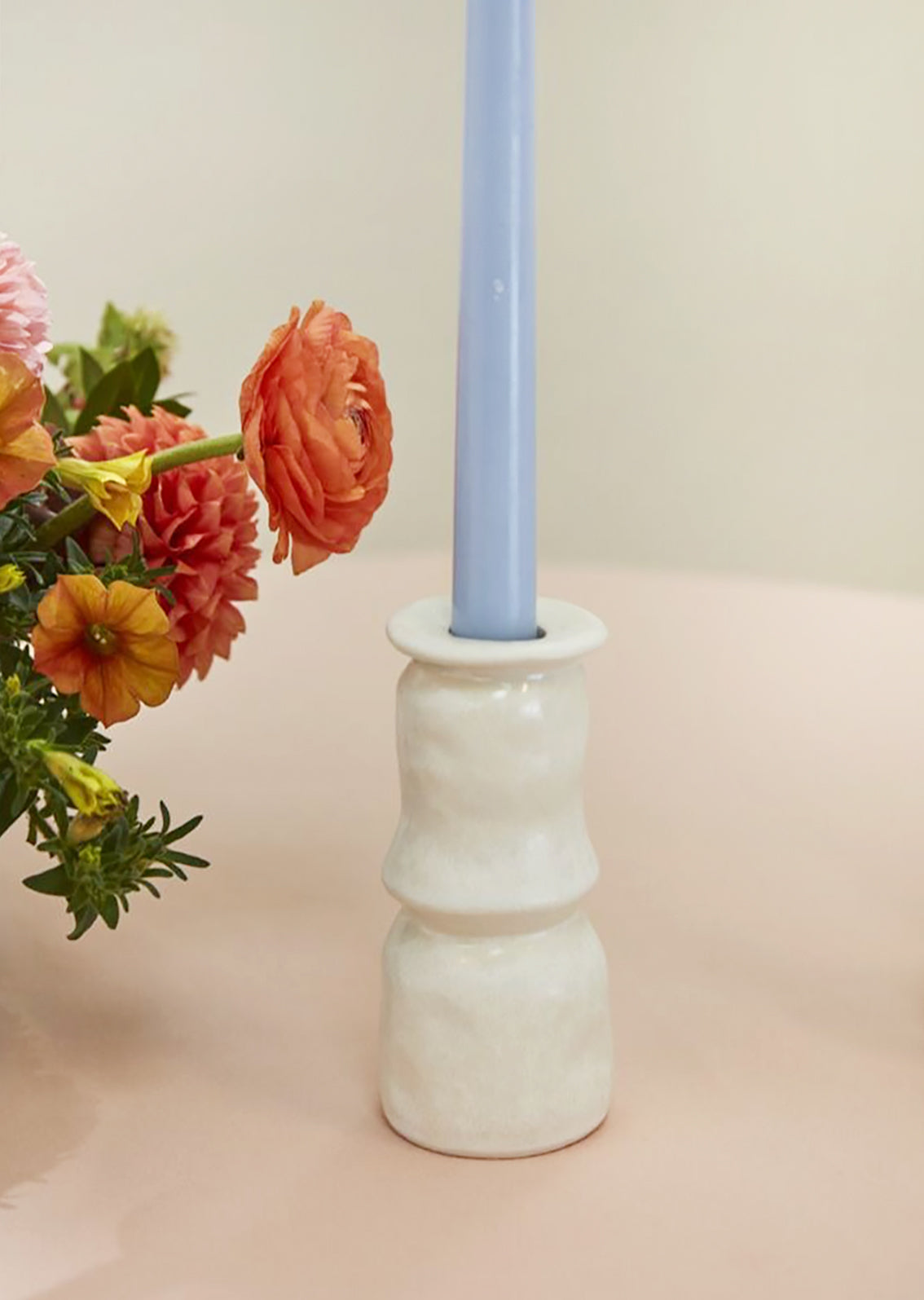 Satin finish ceramic candleholders in white.