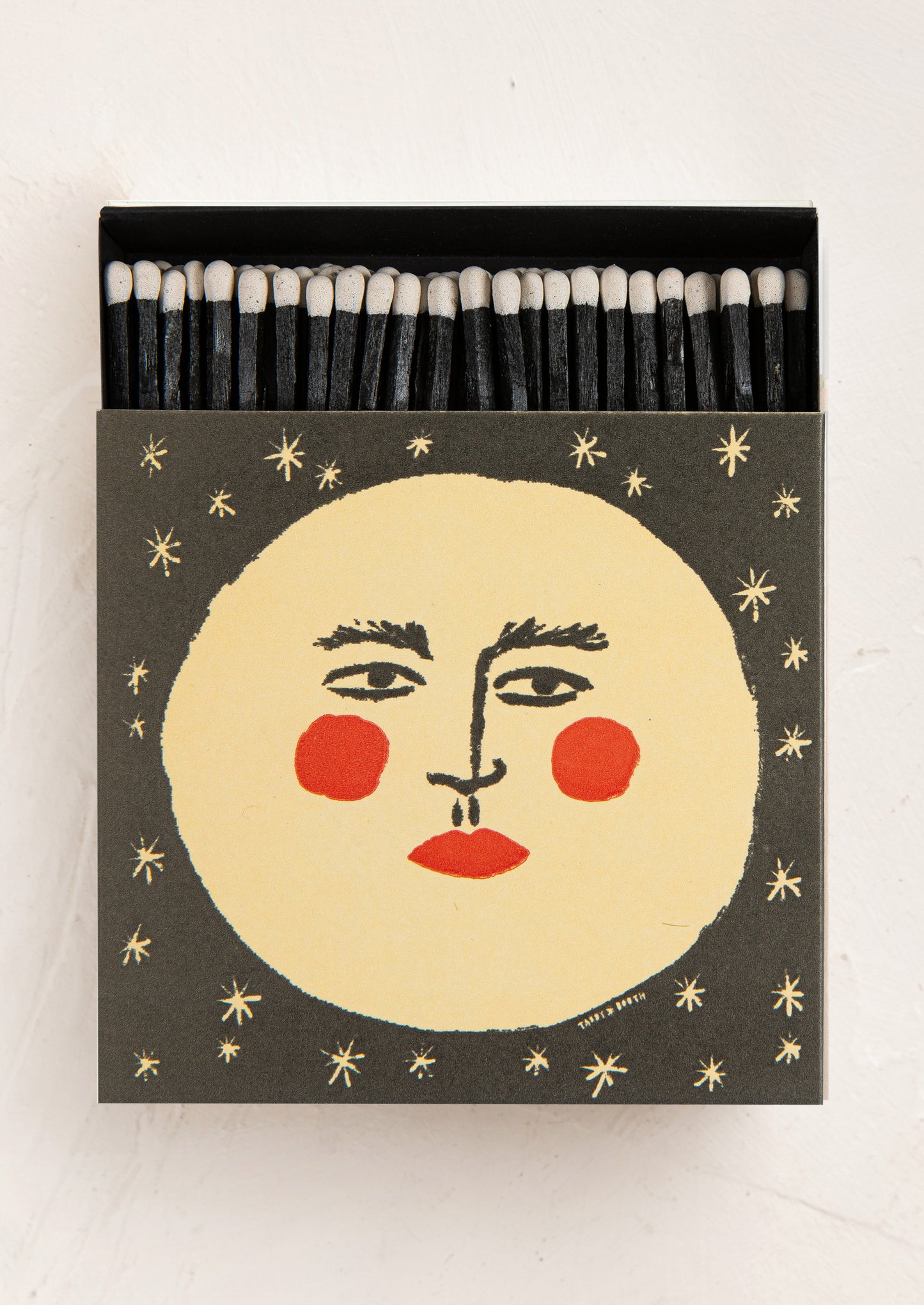 Matches with a face design on the box against a white background
