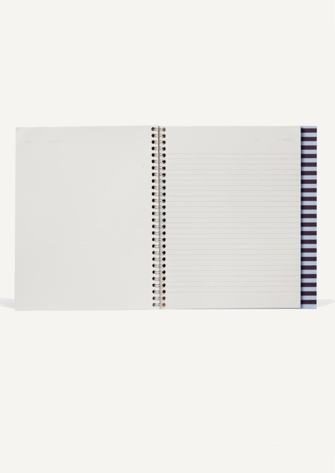 A spiral bound notebook with blank left side, ruled right side.