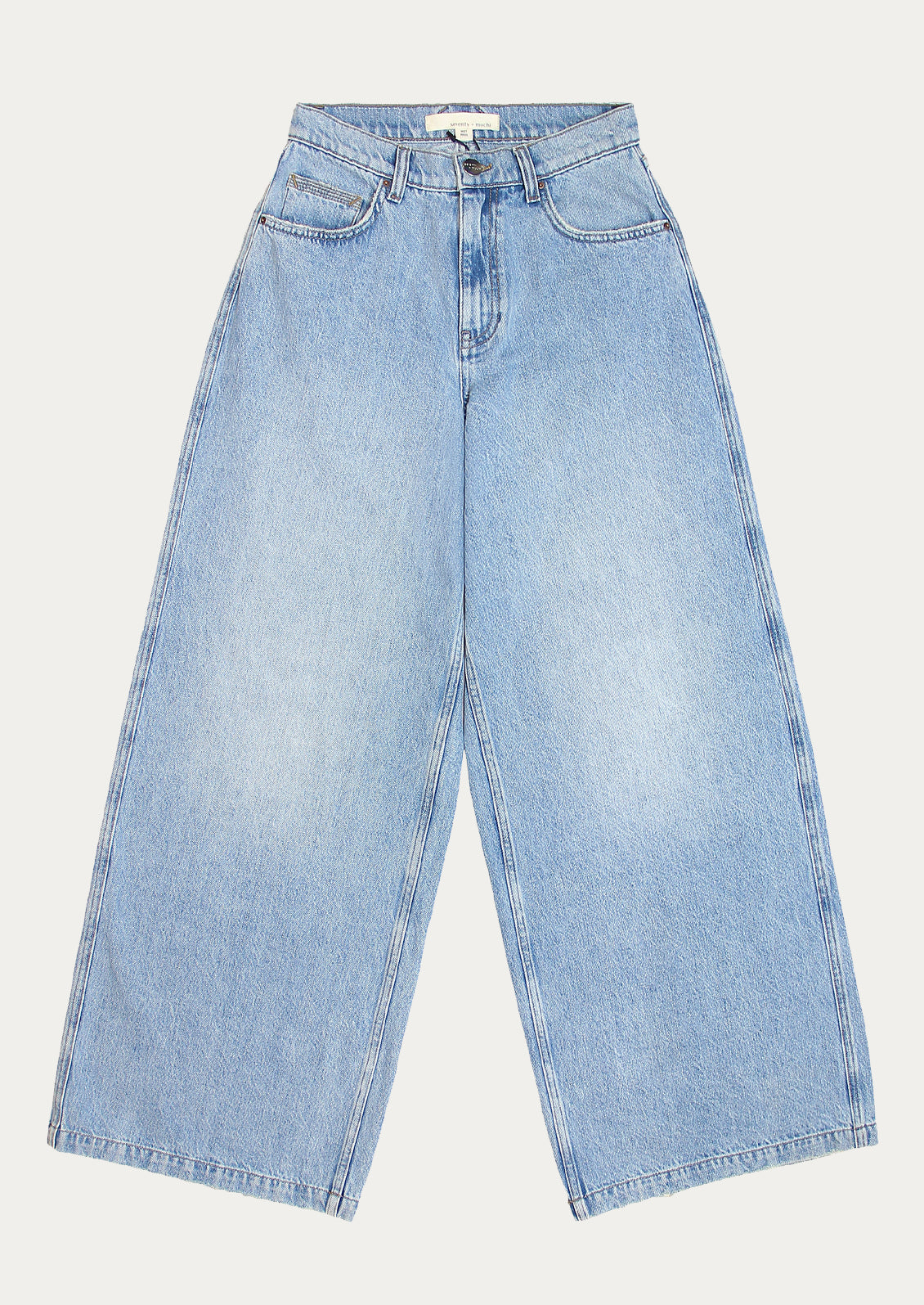 A pair of medium wash wide leg jeans.