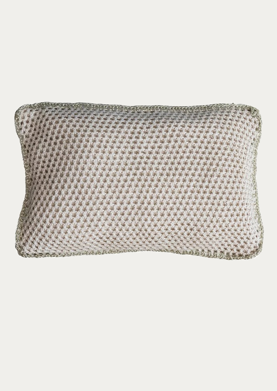 Crochet white pillow on a light gray background