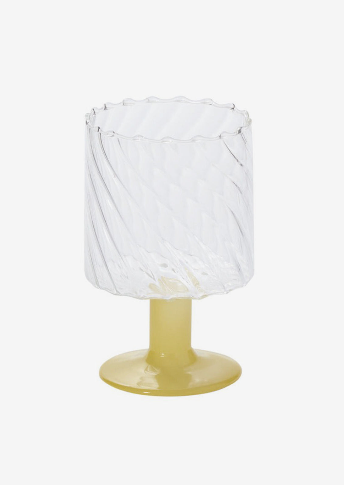 A fluted wine glass with opaque yellow glass stem.