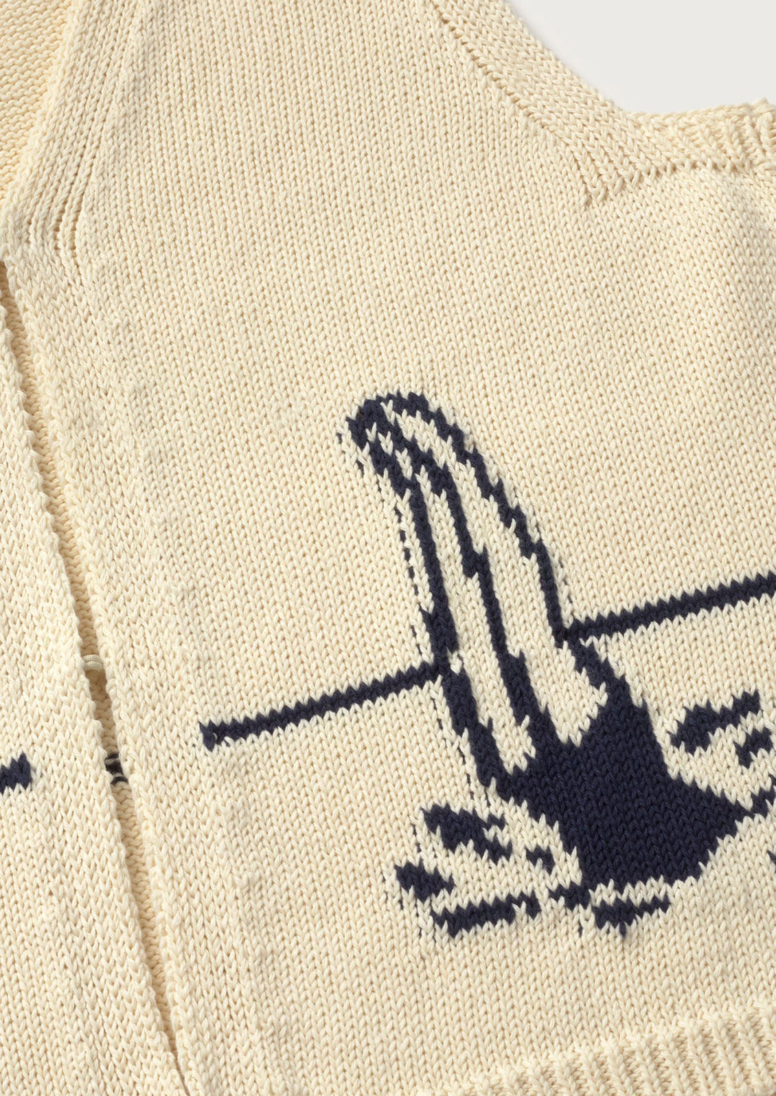 Close-up of a beige sweater.