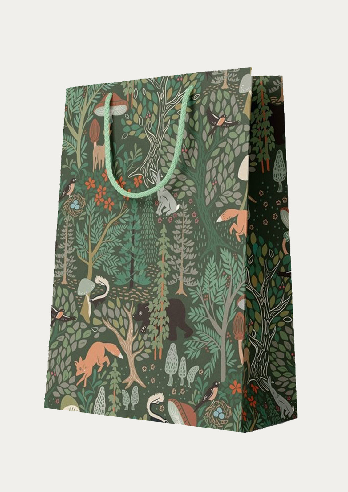 Gift bag with forest animal pattern on a dark green background.