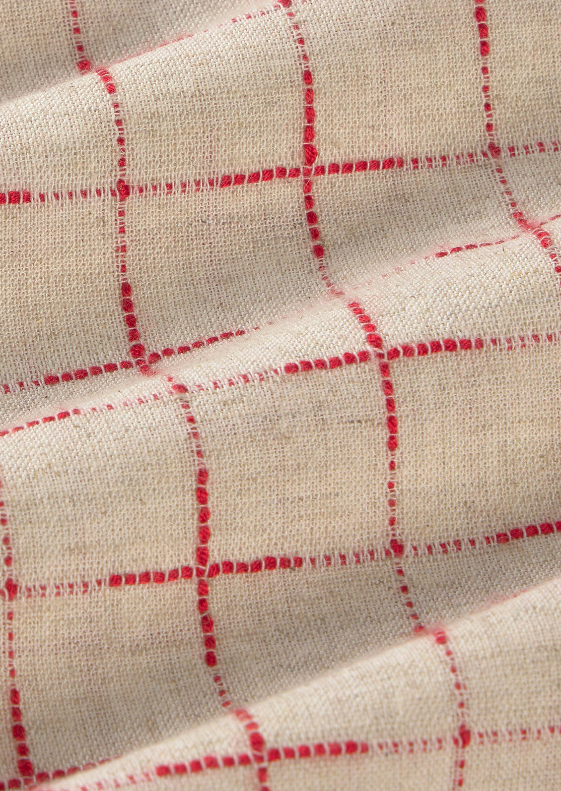 Close-up of fabric with red checkered pattern